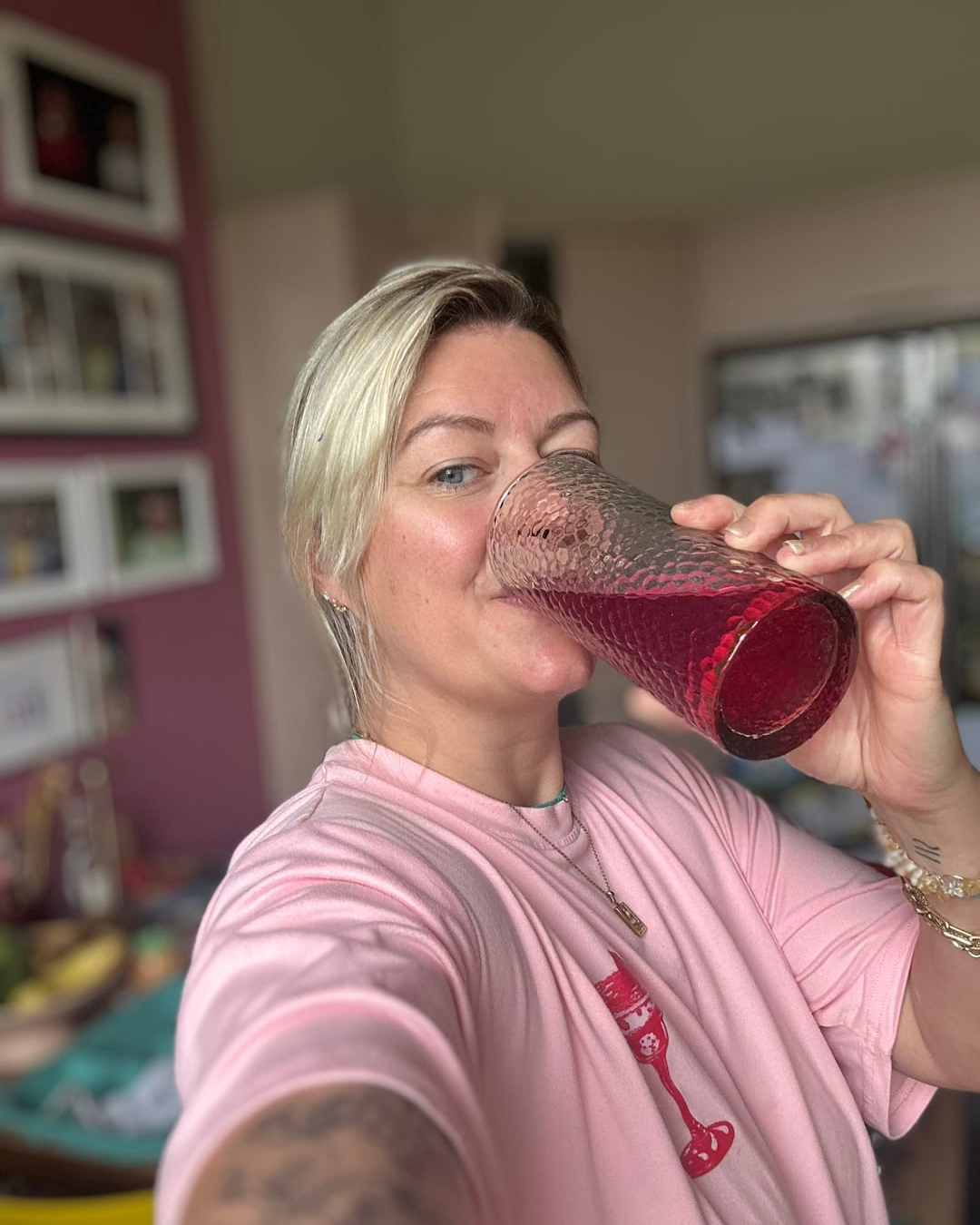 Gut Wealth customer enjoying a postbiotic supplement drink for gut health and bloating relief